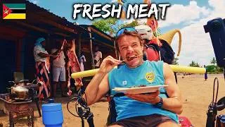 Miniature : Eating Pork Next to a Hanging Carcass in Africa 🇲🇿 vA75-S2