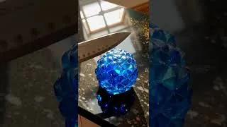 Miniature : Sapphire shaped like a pineapple being sliced with a sharp knife